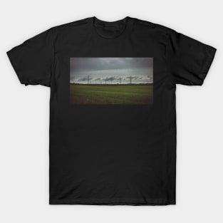 Moody sky over meadow and power lines T-Shirt